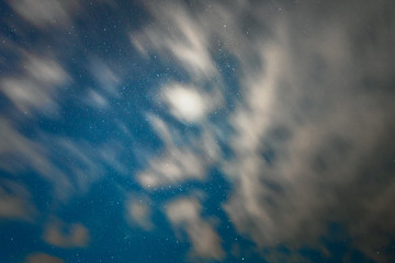 night starry sky with long exposure clouds