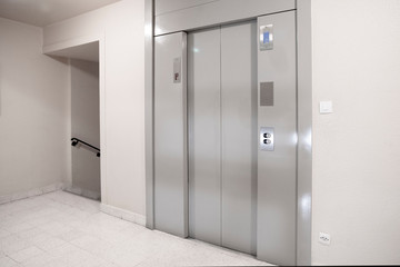 Elevator door in the entrance hall of an apartment building