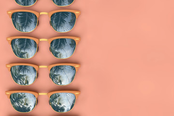 Summer sunglasses with tropical palm tree reflections. 3D Rendering