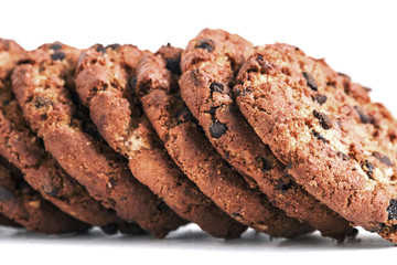 chocolate cookies horizontal stack on white background close up