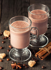 Chocolate, coffee, milk, banana shake on wooden background. Smoothie with cookies. Milkshake. Protein diet. Healthy food concept.