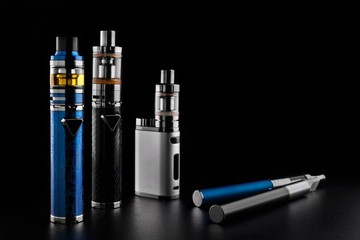 electronic cigarettes or vaping devices on black background