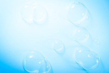 Beautiful abstract close up color white and blue soap bubbles background and wallpaper