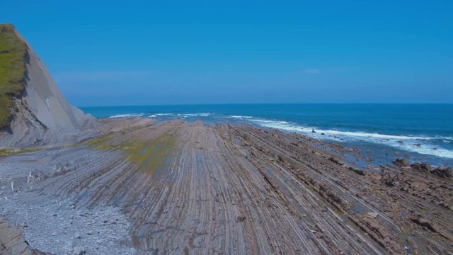 Pan shot over flysch at low tide