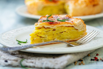 Piece of French puff pastry with potatoes.