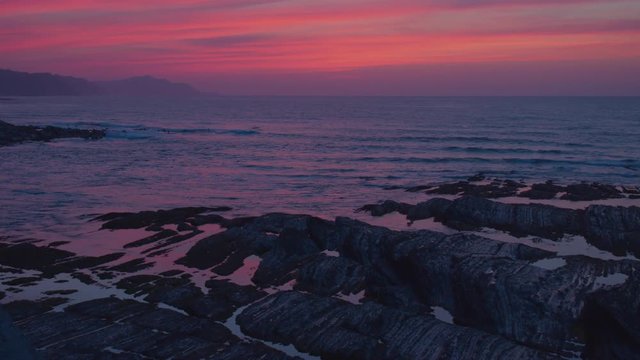 Red sky and its reflections on the seascape