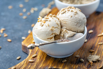 Ice cream with halva and sunflower seeds close up.