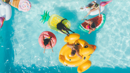 group of friends having fun in the swimming pool
