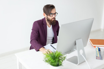 People and technology concept - Man sits and works at the computer