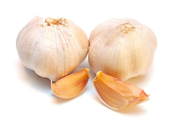 Whole garlic with slices isolated on white