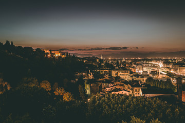 Night cityscape of Florence from a high vantage point. The famous bridge Ponte Vecchio at night in Florence, Tuscany, Italy.