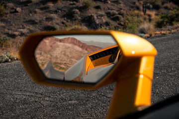 Empty Road Visible in Sports Car Mirror - obrazy, fototapety, plakaty