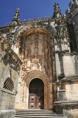 Fototapeta na wymiar A door of the Convento de Cristo (Convent of Christ) in Tomar, Portugal