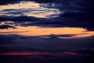 Beautiful sunset - dark sky with clouds and sunlight