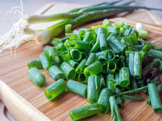 Green Onion on wood background