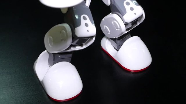 Robotic dance with fixations.   Robot very clearly shows different dance movements with arms and legs. Artificial intelligence (AI). New technologies with robotic mind.