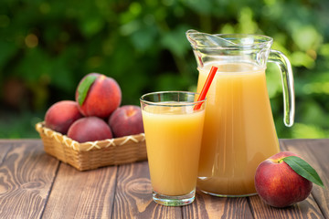 peach juice in glass and jug