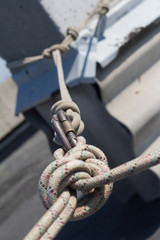 Close-up system of ropes and carbines mounted on the roof for the industrial climber, selective focus