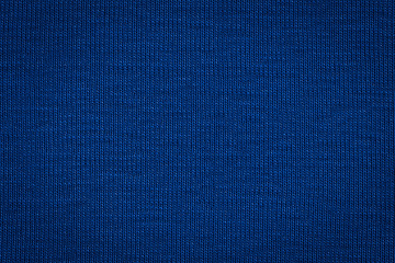 Fototapeta na wymiar Texture of real dark blue knitwear, textile background.