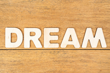 Word dream on a wooden table