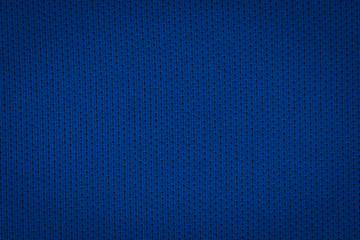 Texture of a real dark blue knit. Fabric background.