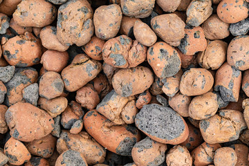 Expanded clay. A pile of expanded clay. Texture of expanded clay.