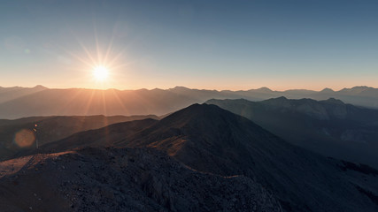 Beautiful landscape in the mountains at sunset. Lovely view of the Taurus Mountains from the top of mount Tahtali at sunset. Kemer, Turkey. Postcard view