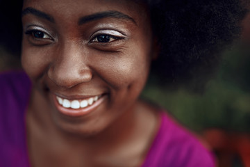 Beautiful afro-american woman looking away and smiling