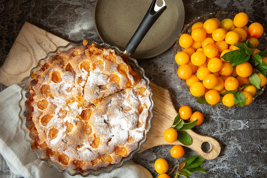 yellow plum mirabelle. Plum pie on a dark background. Summer fruit season.harvest.