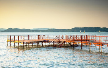 Pier with sunset at lake Balaton