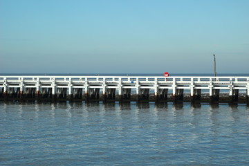 Obraz premium Port entrance and pier in Nieuwpoort. Flanders. Belgium.