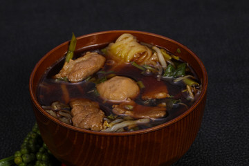 Thai style soup with meat and mushrooms