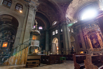 View of the pulpit inside the Cattedrale di San Giusto Martire with the evening light entering tnrough the rosette, Trieste, Italy 