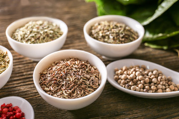 Different spices on wooden background
