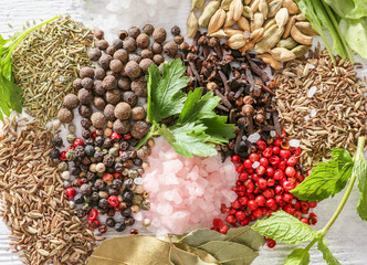 Different herbs, salt and spices on table