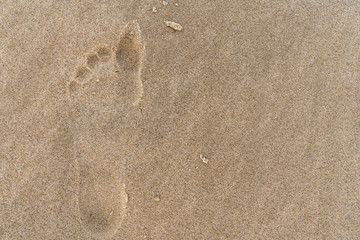 Barfuß Fußabdruck im Sand