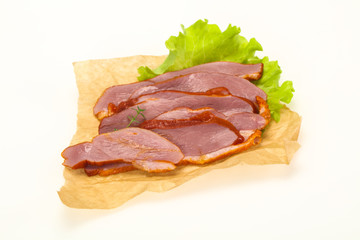 Sliced smoked duck breast served salad