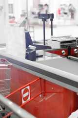 Empty cash desk with closed way border in supermarket