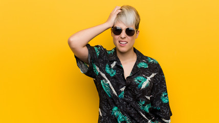 Young curvy woman wearing a summer look being shocked, she has remembered important meeting.