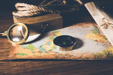 compass with magnifier on the map