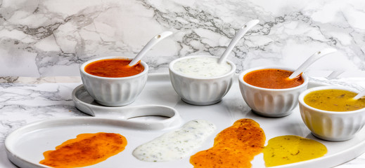 French, ranch, catalina and italian dressings on a tasting plate. Calgary, Alberta, Canada