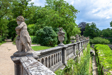 fragment of railing with statues in the castle garden