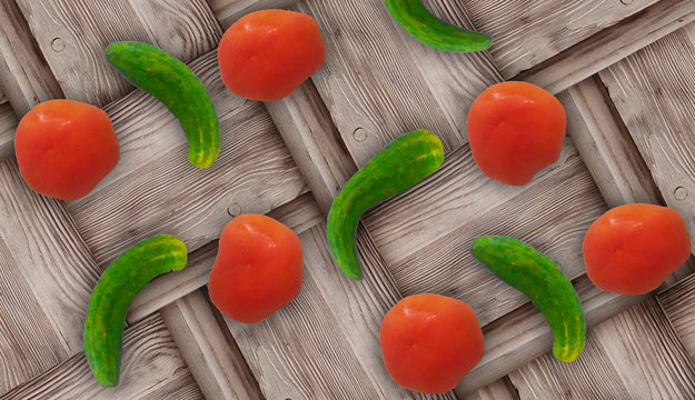Fresh ugly croocked green cucumbers and fresh red tomatoes on wooden background