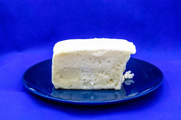 Butter on a blue plate against colourful back drop. Calgary, Alberta, Canada