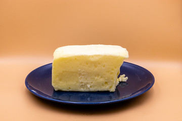 Butter on a blue plate against colourful back drop. Calgary, Alberta, Canada