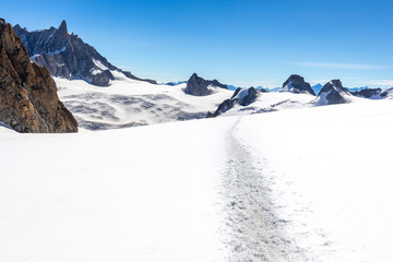 Snow trail footpath  Alps peaks view landscape, Mont Blanc massif.