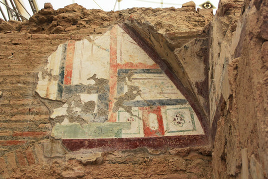Archaeological remains with decorative frescoes paintings in a hillside house on the slopes of the ancient city ruins of Ephesus, Turkey near Selcuk.