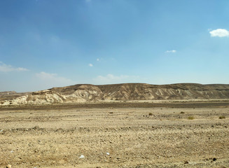 Desert landscape with rocks, hills and mountains