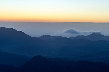 Naklejka na ściany i meble View from the mountain of Moses, a beautiful sunrise in the mountains of Egypt