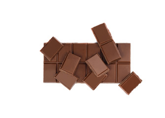 Milk organic chocolate bar and pieces isolated over white background.